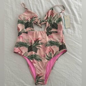 One-piece swimsuit by Shore, pink with palms. NWT, size medium